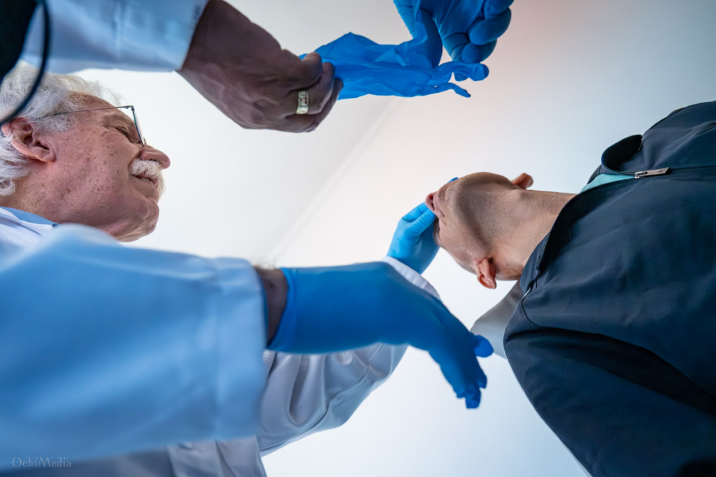 Dr. Frederik J. Menick examines a patient during a preoperative clinic before facial reconstructive surgery at Ivano-Frankivsk Regional Clinical Hospital, Ukraine.