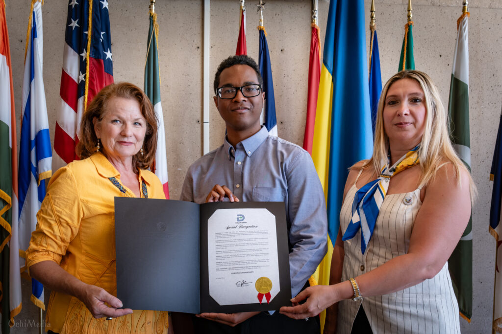 Chrystya Geremesz, Deionte Harvey, and Tamara Velsher present the City of Dallas Special Recognition marking Ukraine’s 35th Independence Day.
